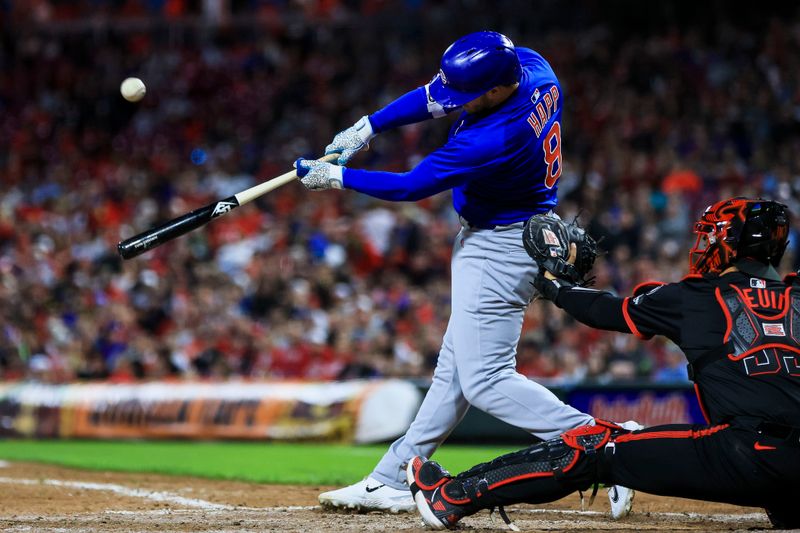 May 23, 2025; Cincinnati, Ohio, USA; Chicago Cubs outfielder Ian Happ (8) hits a single in the seventh inning against the Cincinnati Reds at Great American Ball Park. Mandatory Credit: Katie Stratman-Imagn Images