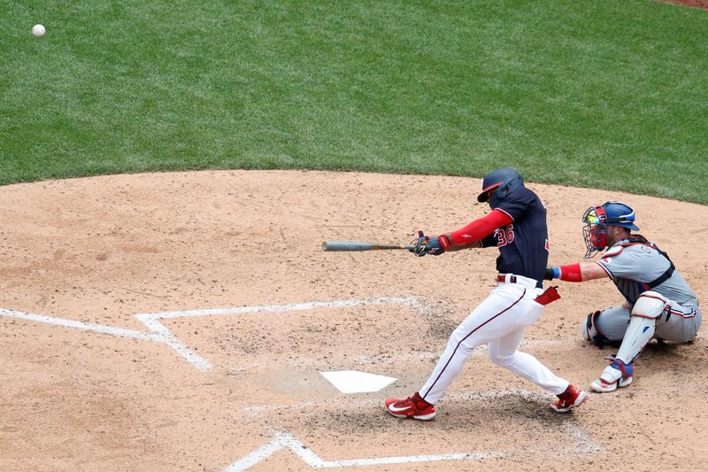 Jul 9, 2023; Washington, District of Columbia, USA; Washington Nationals left fielder Stone Garrett (36) hits a home run against the Texas Rangers during the seventh inning at Nationals Park. Mandatory Credit: Geoff Burke-USA TODAY Sports