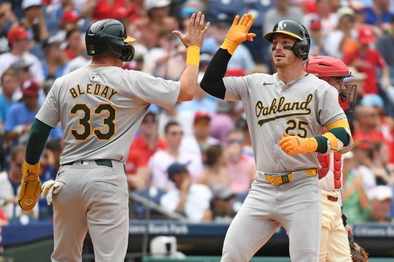 Jul 14, 2024; Philadelphia, Pennsylvania, USA; Oakland Athletics outfielder Brent Rooker (25) celebrates his two-run home run with outfielder JJ Bleday (33) against the Philadelphia Phillies during the fourth inning at Citizens Bank Park. Mandatory Credit: Eric Hartline-USA TODAY Sports