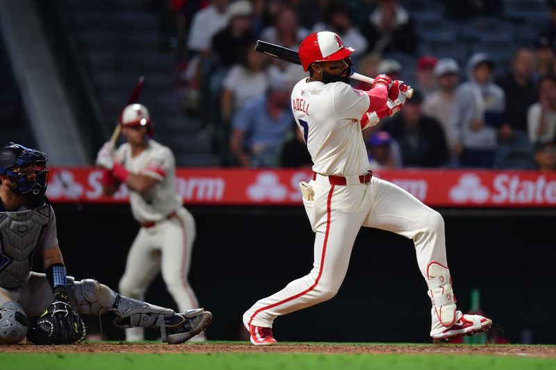 May 27, 2025; Anaheim, California, USA; Los Angeles Angels right fielder Jo Adell (7) reaches first on a fielders choice that brings in a run against the New York Yankees during the ninth inning at Angel Stadium. Mandatory Credit: Gary A. Vasquez-Imagn Images
