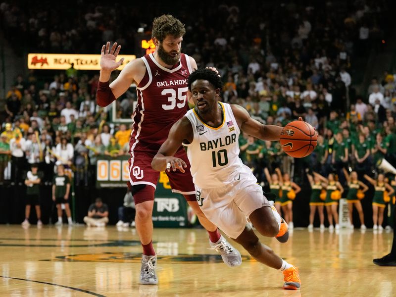 Feb 8, 2023; Waco, Texas, USA;  Baylor Bears guard Adam Flagler (10) drives to the basket past Oklahoma Sooners forward Tanner Groves (35) during the second half at Ferrell Center. Mandatory Credit: Chris Jones-USA TODAY Sports