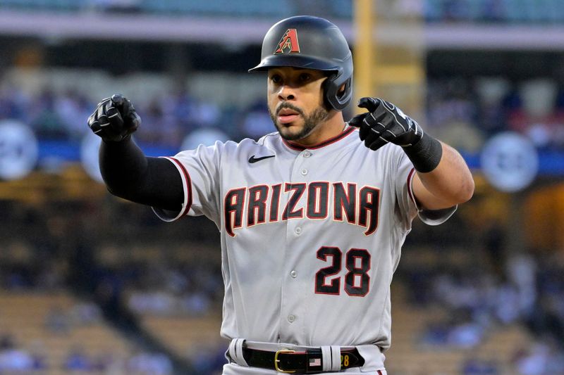 Oct 9, 2023; Los Angeles, California, USA; Arizona Diamondbacks left fielder Tommy Pham (28) reacts after hitting a single against the Los Angeles Dodgers during the first inning for game two of the NLDS for the 2023 MLB playoffs at Dodger Stadium. Mandatory Credit: Jayne Kamin-Oncea-USA TODAY Sports