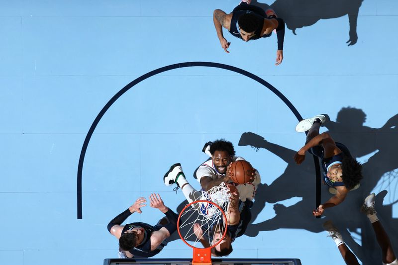 MEMPHIS, TN - NOVEMBER 22: Andre Drummond #5 of the Philadelphia 76ers drives to the basket during the game against the Memphis Grizzlies on November 22, 2024 at FedExForum in Memphis, Tennessee. NOTE TO USER: User expressly acknowledges and agrees that, by downloading and or using this photograph, User is consenting to the terms and conditions of the Getty Images License Agreement. Mandatory Copyright Notice: Copyright 2024 NBAE (Photo by Joe Murphy/NBAE via Getty Images)