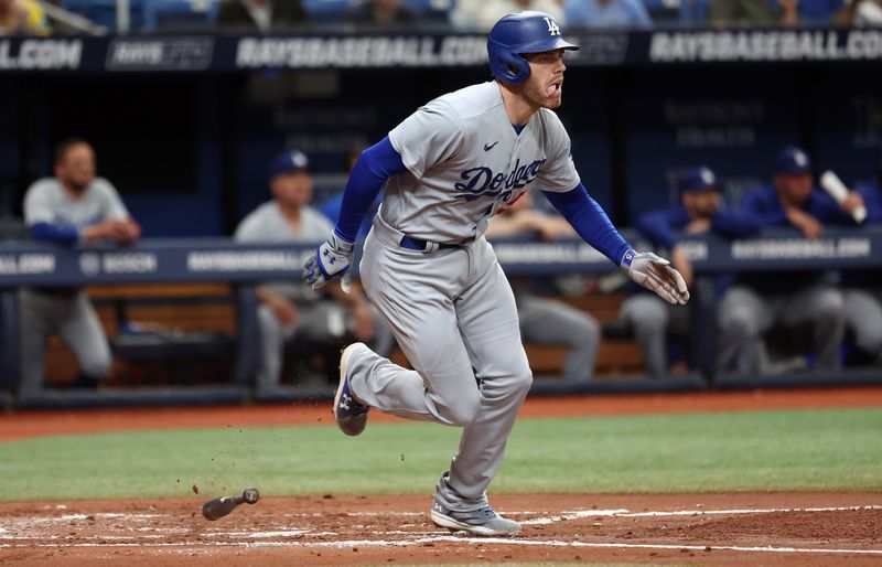 May 27, 2023; St. Petersburg, Florida, USA;  Los Angeles Dodgers first baseman Freddie Freeman (5) doubles during the third inning against the Tampa Bay Rays at Tropicana Field. Mandatory Credit: Kim Klement-USA TODAY Sports