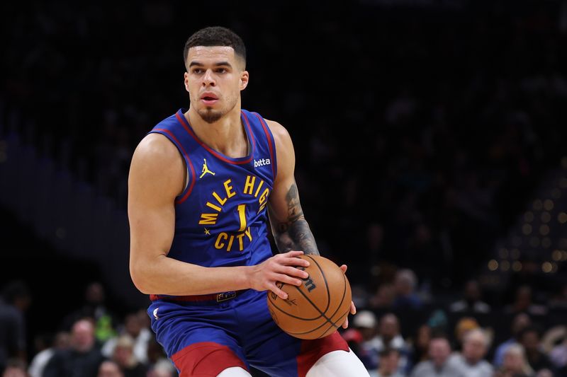 WASHINGTON, DC - JANUARY 21: Michael Porter Jr. #1 of the Denver Nuggets in action against the Washington Wizards at Capital One Arena on January 21, 2024 in Washington, DC. NOTE TO USER: User expressly acknowledges and agrees that, by downloading and or using this photograph, User is consenting to the terms and conditions of the Getty Images License Agreement. (Photo by Patrick Smith/Getty Images)