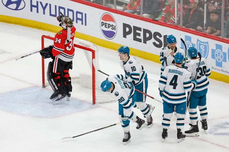 Mar 17, 2024; Chicago, Illinois, USA; San Jose Sharks center Klim Kostin (10) celebrates with teammates after scoring a goal against the Chicago Blackhawks during the first period at United Center. Mandatory Credit: Kamil Krzaczynski-USA TODAY Sports