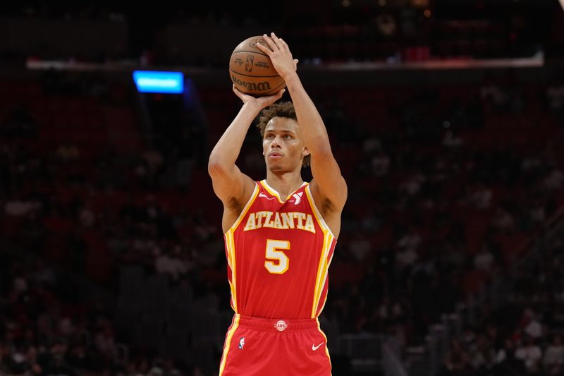 MIAMI, FL - OCTOBER 16: Dyson Daniels #5 of the Atlanta Hawks shoots a free throw during the game against the Miami Heat during a preseason game on October 16, 2024 at Kaseya Center in Miami, Florida. NOTE TO USER: User expressly acknowledges and agrees that, by downloading and or using this Photograph, user is consenting to the terms and conditions of the Getty Images License Agreement. Mandatory Copyright Notice: Copyright 2024 NBAE (Photo by Eric Espada/NBAE via Getty Images)