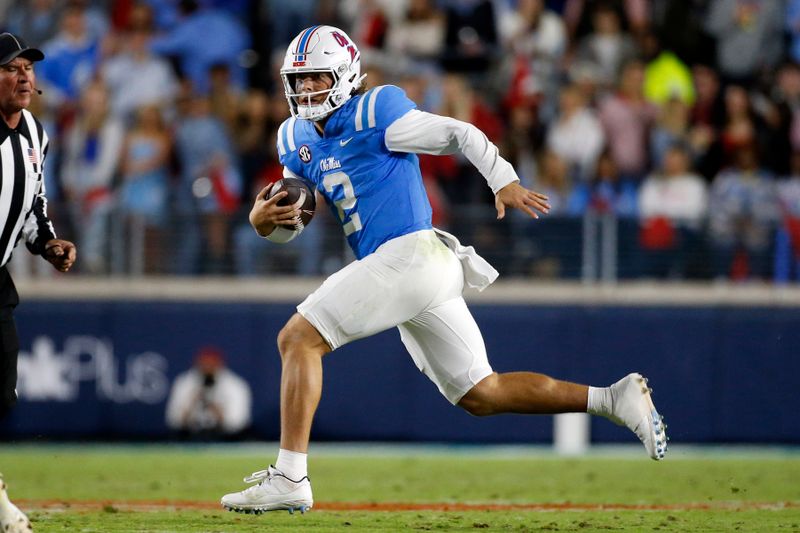 Oct 7, 2023; Oxford, Mississippi, USA; Mississippi Rebels quarterback Jaxson Dart (2) runs the ball during the first half against the Arkansas Razorbacks at Vaught-Hemingway Stadium. Mandatory Credit: Petre Thomas-USA TODAY Sports