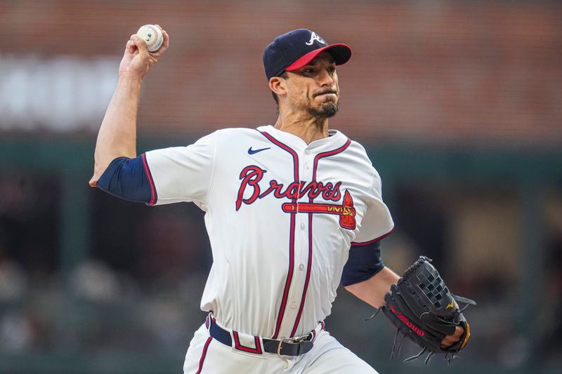 Sep 4, 2024; Cumberland, Georgia, USA; Atlanta Braves pitcher Charlie Morton (50) pitches against the Colorado Rockies during the first inning at Truist Park. Mandatory Credit: Dale Zanine-Imagn Images