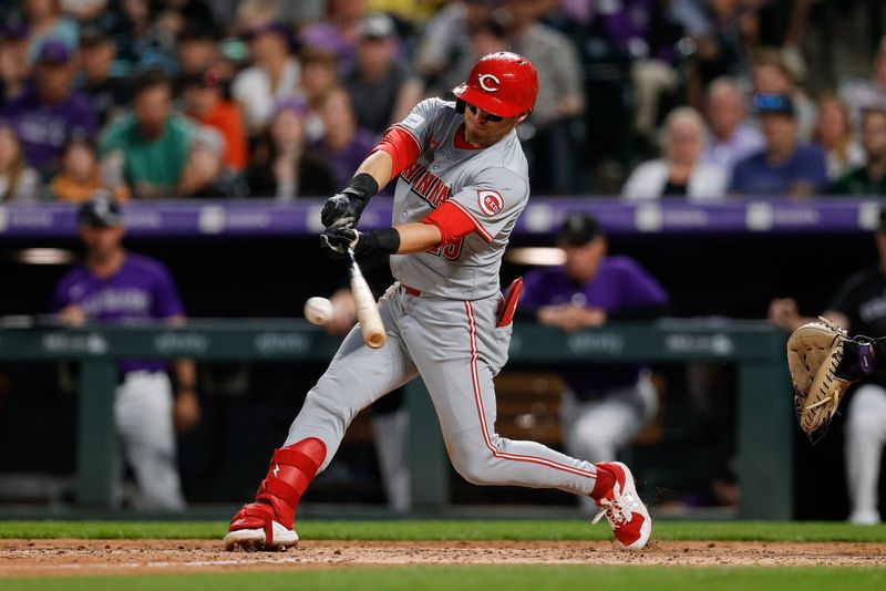 Jun 3, 2024; Denver, Colorado, USA; Cincinnati Reds center fielder TJ Friedl (29) hits a single in the sixth inning against the Colorado Rockies at Coors Field. Mandatory Credit: Isaiah J. Downing-USA TODAY Sports