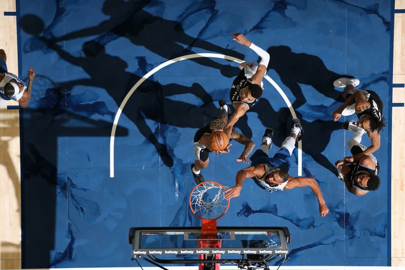 MINNEAPOLIS, MN -  FEBRUARY 27: Victor Wembanyama #1 of the San Antonio Spurs goes up for the rebound during the game against the Minnesota Timberwolves on February 27, 2024 at Target Center in Minneapolis, Minnesota. NOTE TO USER: User expressly acknowledges and agrees that, by downloading and or using this Photograph, user is consenting to the terms and conditions of the Getty Images License Agreement. Mandatory Copyright Notice: Copyright 2024 NBAE (Photo by David Sherman/NBAE via Getty Images)