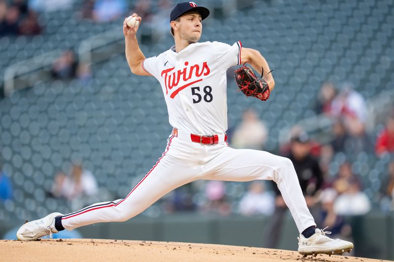 Apr 23, 2025; Minneapolis, Minnesota, USA; Minnesota Twins starting pitcher David Festa (58) throws to Chicago White Sox center fielder Luis Robert Jr. (88) in the first inning at Target Field. Mandatory Credit: Matt Blewett-Imagn Images