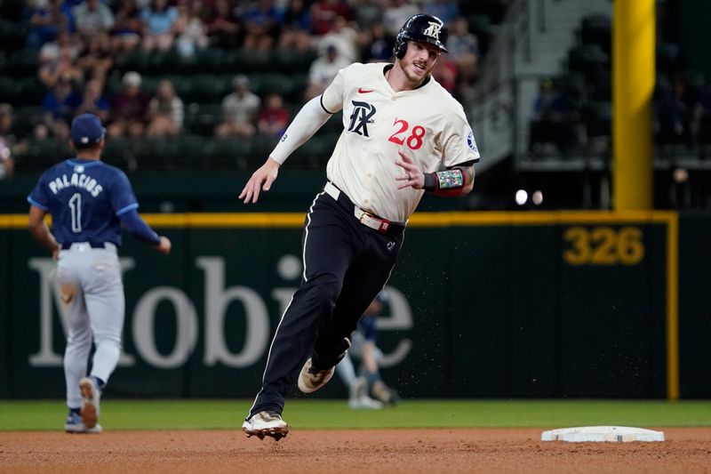 Jul 5, 2024; Arlington, Texas, USA; Texas Rangers catcher Jonah Heim (28) advances to third base during the fourth inning against the Tampa Bay Rays at Globe Life Field. Mandatory Credit: Raymond Carlin III-USA TODAY Sports