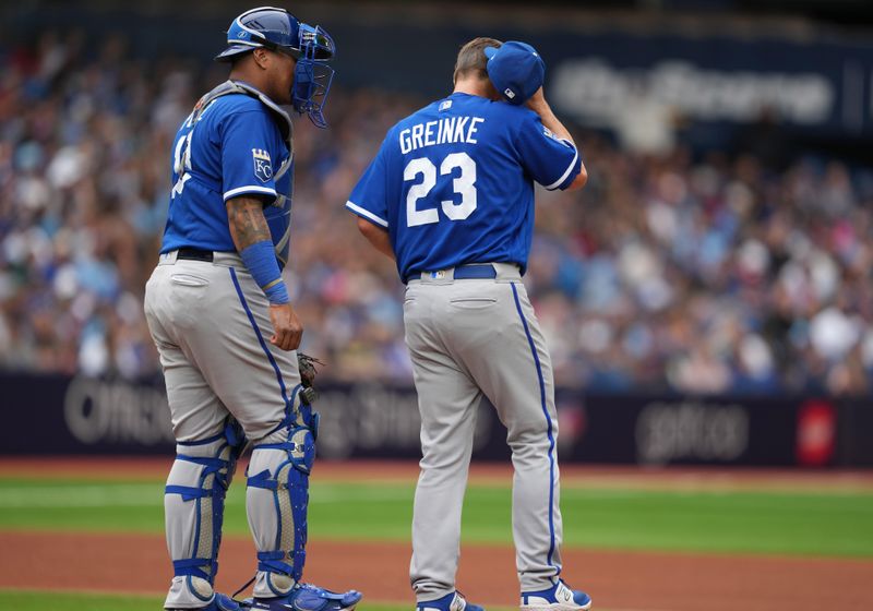 Sep 9, 2023; Toronto, Ontario, CAN; Kansas City Royals catcher Salvador Perez (13) talks with pitcher Zack Greinke (23) against the Toronto Blue Jays during the fourth inning at Rogers Centre. Mandatory Credit: Nick Turchiaro-USA TODAY Sports