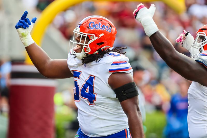 Oct 14, 2023; Columbia, South Carolina, USA; (EDITORS NOTE: Offensive Gesture in Image) Florida Gators offensive lineman Micah Mazzccua (54) makes an obscene gesture towards South Carolina Gamecocks fans following a Gators touchdown in the first quarter at Williams-Brice Stadium. Mandatory Credit: Jeff Blake-USA TODAY Sports