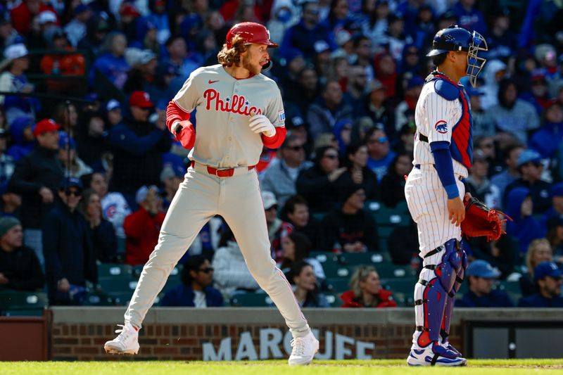 Apr 26, 2025; Chicago, Illinois, USA; Philadelphia Phillies third baseman Alec Bohm (28) scores against the Chicago Cubs during the fourth inning at Wrigley Field. Mandatory Credit: Kamil Krzaczynski-Imagn Images