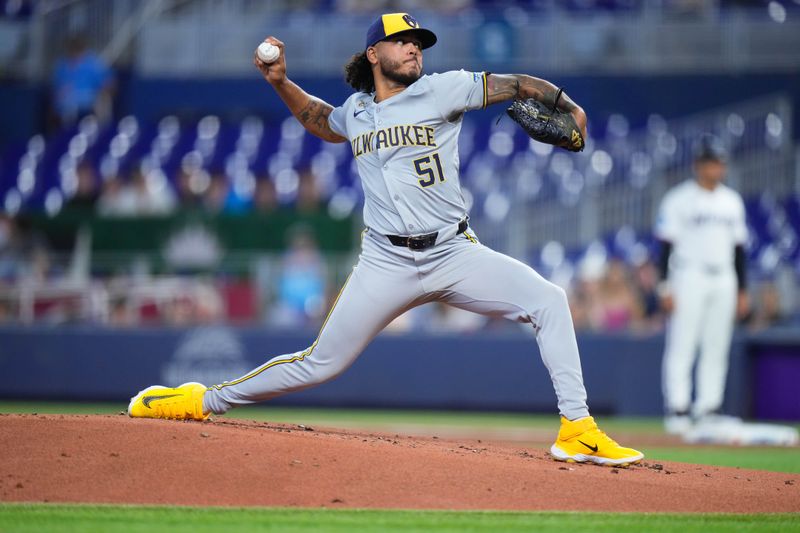 May 22, 2024; Miami, Florida, USA; Milwaukee Brewers pitcher Freddy Peralta (51) throws a pitch against the Miami Marlins during the first inning at loanDepot Park. Mandatory Credit: Rich Storry-USA TODAY Sports