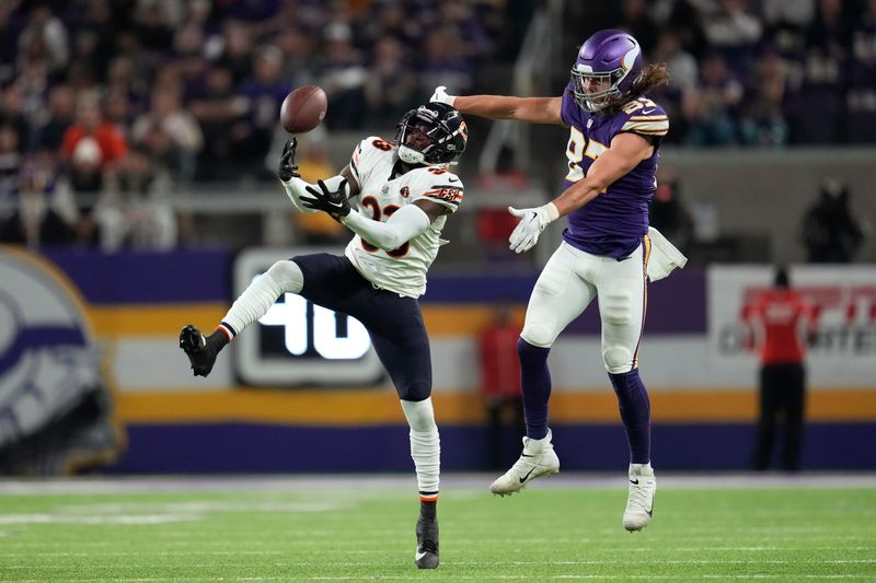 Chicago Bears cornerback Jaylon Johnson (33) breaks up a pass intended for Minnesota Vikings tight end T.J. Hockenson (87) during the first half of an NFL football game, Monday, Nov. 27, 2023, in Minneapolis. (AP Photo/Abbie Parr)