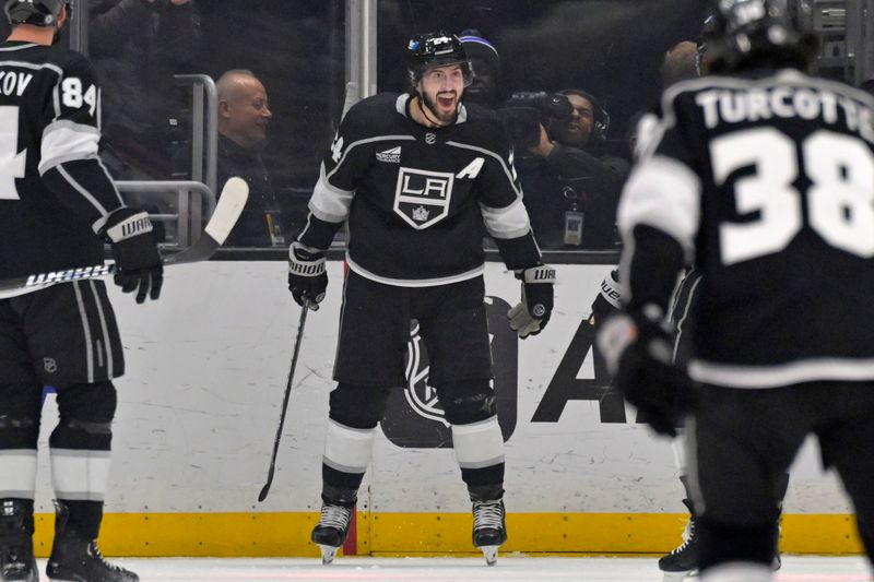 Mar 3, 2024; Los Angeles, California, USA;  Los Angeles Kings center Phillip Danault (24) celebrates after scoring a goal in the first period against the New Jersey Devils at Crypto.com Arena. Mandatory Credit: Jayne Kamin-Oncea-USA TODAY Sports