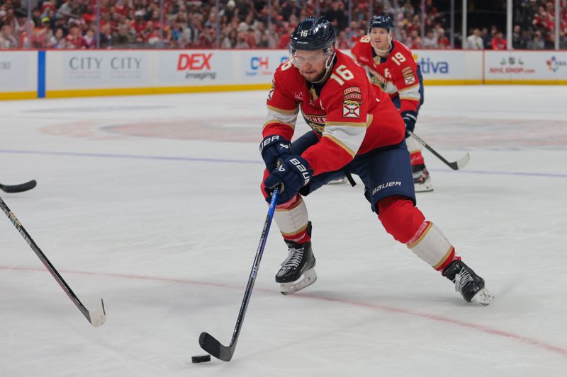 Nov 30, 2024; Sunrise, Florida, USA; Florida Panthers center Aleksander Barkov (16) moves the puck against the Carolina Hurricanes during the second period at Amerant Bank Arena. Mandatory Credit: Sam Navarro-Imagn Images