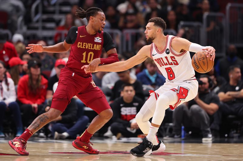 CHICAGO, ILLINOIS - OCTOBER 18: Zach LaVine #8 of the Chicago Bulls dribbles against Darius Garland #10 of the Cleveland Cavaliers during the first half of a preseason game at the United Center on October 18, 2024 in Chicago, Illinois. NOTE TO USER: User expressly acknowledges and agrees that, by downloading and or using this photograph, User is consenting to the terms and conditions of the Getty Images License Agreement.  (Photo by Michael Reaves/Getty Images)