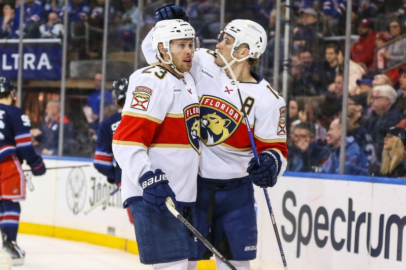 Mar 23, 2024; New York, New York, USA; Florida Panthers left wing Matthew Tkachuk (19) celebrates with center Carter Verhaeghe (23) after scoring a goal in the first period against the New York Rangers at Madison Square Garden. Mandatory Credit: Wendell Cruz-USA TODAY Sports