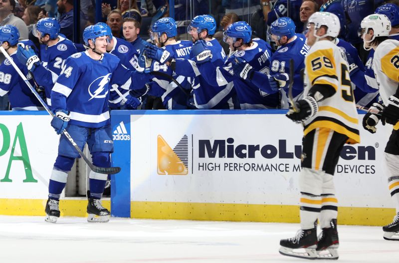 Dec 6, 2023; Tampa, Florida, USA; Tampa Bay Lightning left wing Tanner Jeannot (84) is congratulated after he scored against the Pittsburgh Penguins during the second period at Amalie Arena. Mandatory Credit: Kim Klement Neitzel-USA TODAY Sports