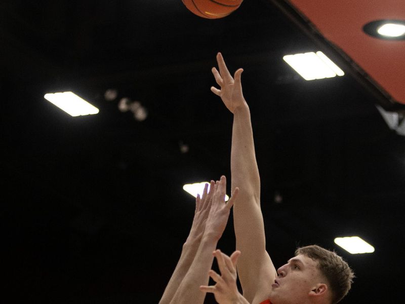 Jan 19, 2023; Stanford, California, USA; Oregon State Beavers forward Tyler Bilodeau (10) shoots over Stanford Cardinal forward Maxime Raynaud (42) during the first half at Maples Pavilion. Mandatory Credit: D. Ross Cameron-USA TODAY Sports