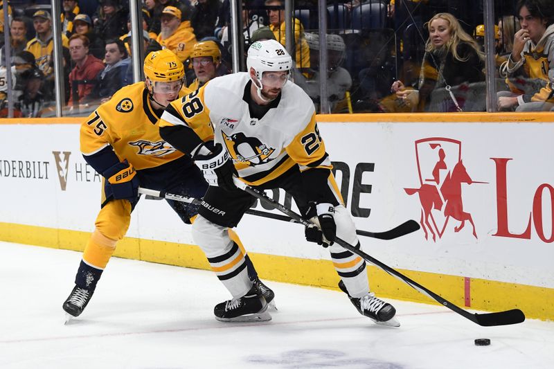 Nov 28, 2023; Nashville, Tennessee, USA; Pittsburgh Penguins defenseman Marcus Pettersson (28) takes the puck from Nashville Predators center Juuso Parssinen (75) during the first period at Bridgestone Arena. Mandatory Credit: Christopher Hanewinckel-USA TODAY Sports