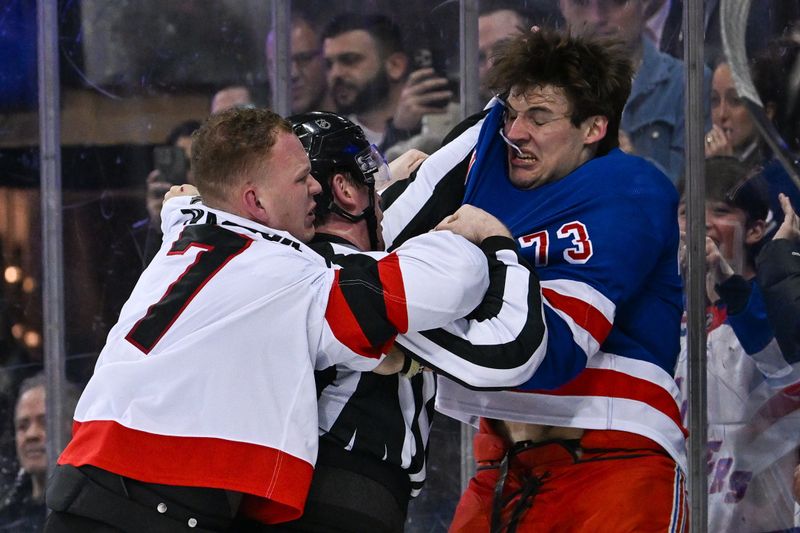Jan 21, 2025; New York, New York, USA;  New York Rangers center Matt Rempe (73) and Ottawa Senators left wing Brady Tkachuk (7) fight during the third period at Madison Square Garden. Mandatory Credit: Dennis Schneidler-Imagn Images