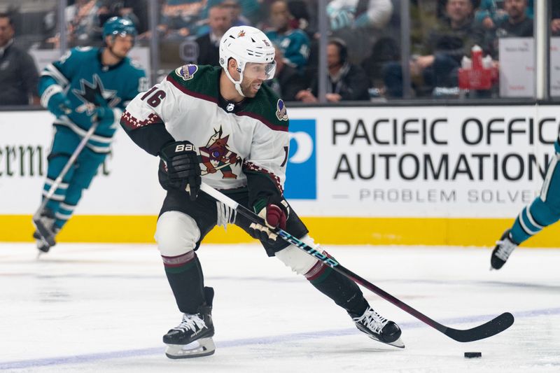 Dec 21, 2023; San Jose, California, USA; Arizona Coyotes left wing Jason Zucker (16) controls the puck during the first period against the San Jose Sharks at SAP Center at San Jose. Mandatory Credit: Stan Szeto-USA TODAY Sports