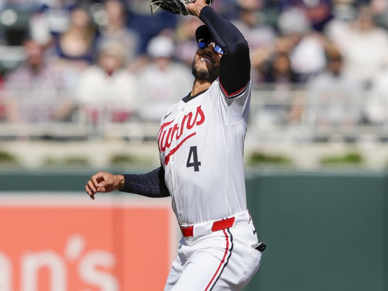 Apr 4, 2024; Minneapolis, Minnesota, USA; Minnesota Twins shortstop Carlos Correa (4) catches the ball for the out during the first inning against the Cleveland Guardians at Target Field. Mandatory Credit: Jordan Johnson-USA TODAY Sports