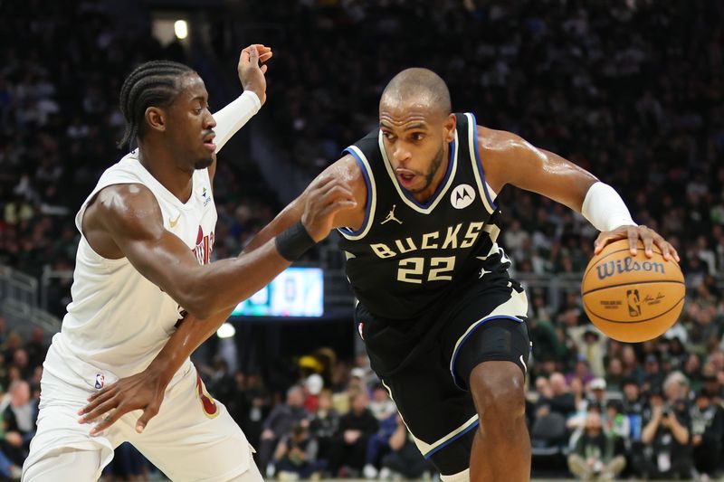 MILWAUKEE, WISCONSIN - JANUARY 26: Khris Middleton #22 of the Milwaukee Bucks is defended by Caris LeVert #3 of the Cleveland Cavaliers during a game at Fiserv Forum on January 26, 2024 in Milwaukee, Wisconsin. NOTE TO USER: User expressly acknowledges and agrees that, by downloading and or using this photograph, User is consenting to the terms and conditions of the Getty Images License Agreement. (Photo by Stacy Revere/Getty Images)