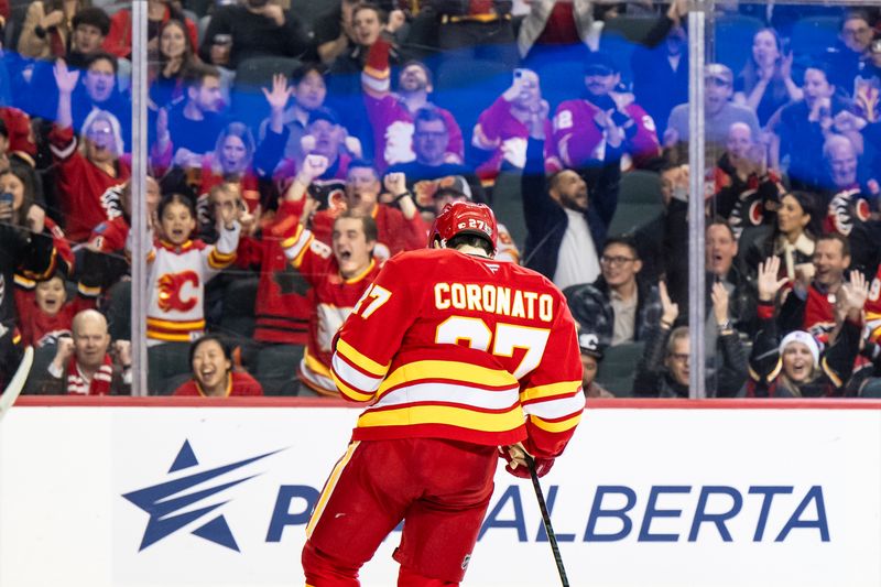 Dec 5, 2024; Calgary, Alberta, CAN; Calgary Flames right wing Matt Coronato (27) and fans celebrate after a goal against the St. Louis Blues during the second period at Scotiabank Saddledome. Mandatory Credit: Brett Holmes-Imagn Images