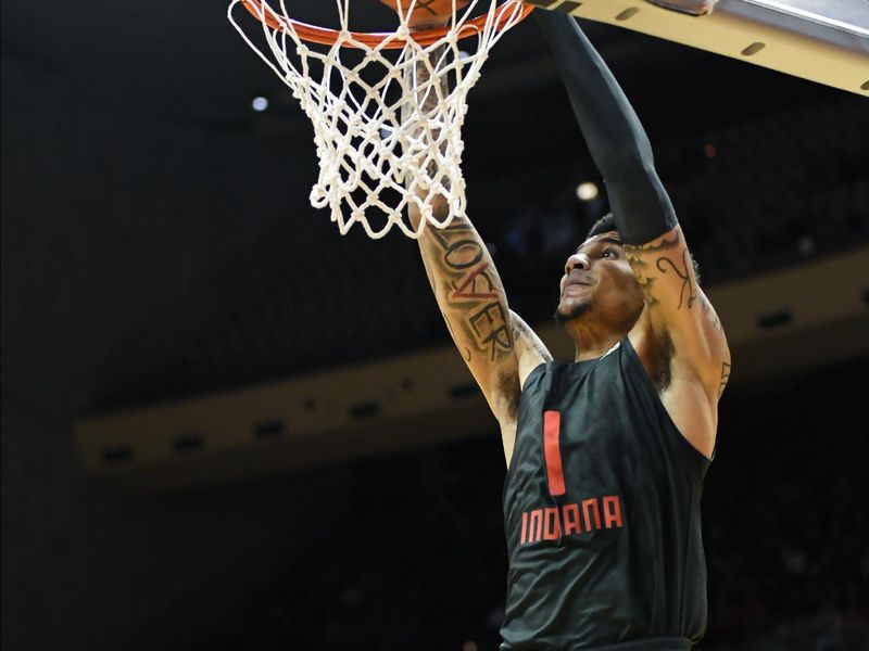 Feb 18, 2024; Bloomington, Indiana, USA;  Indiana Hoosiers center Kel'el Ware (1) dunks the ball past Northwestern Wildcats center Matthew Nicholson (34) during the first half at Simon Skjodt Assembly Hall. Mandatory Credit: Robert Goddin-USA TODAY Sports