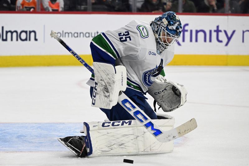 Dec 22, 2025; Philadelphia, Pennsylvania, USA; Vancouver Canucks goaltender Thatcher Demko (35) makes a save against the Philadelphia Flyers during the second period at Xfinity Mobile Arena. Mandatory Credit: Eric Hartline-Imagn Images