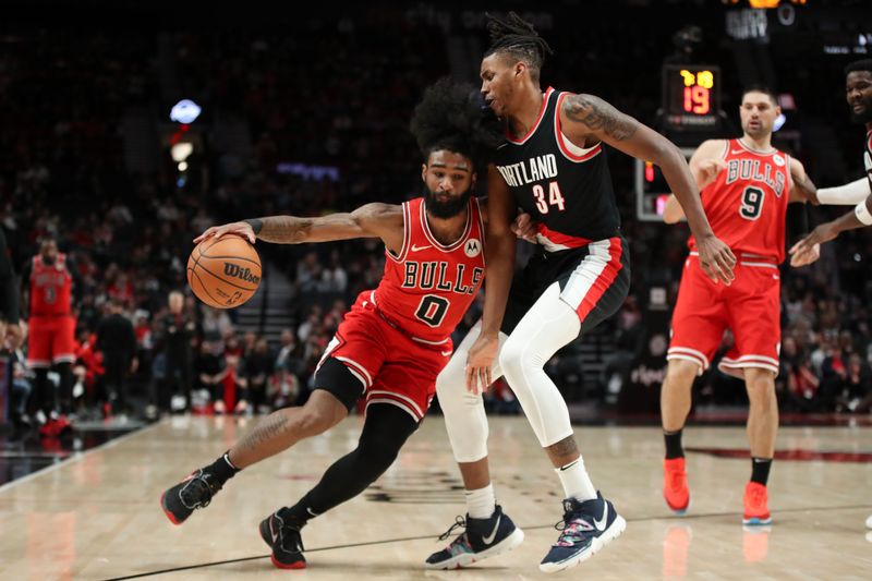 PORTLAND, OREGON - JANUARY 28: Coby White #0 of the Chicago Bulls against Jabari Walker #34 of the Portland Trail Blazers during the first quarter at Moda Center on January 28, 2024 in Portland, Oregon. NOTE TO USER: User expressly acknowledges and agrees that, by downloading and or using this photograph, User is consenting to the terms and conditions of the Getty Images License Agreement.? (Photo by Amanda Loman/Getty Images)