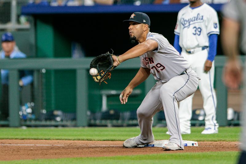 Apr 10, 2024; Kansas City, Missouri, USA; Houston Astros first base José Abreu (79) reaches for a throw at first base during the seventh inning against the Kansas City Royals at Kauffman Stadium. Mandatory Credit: William Purnell-USA TODAY Sports