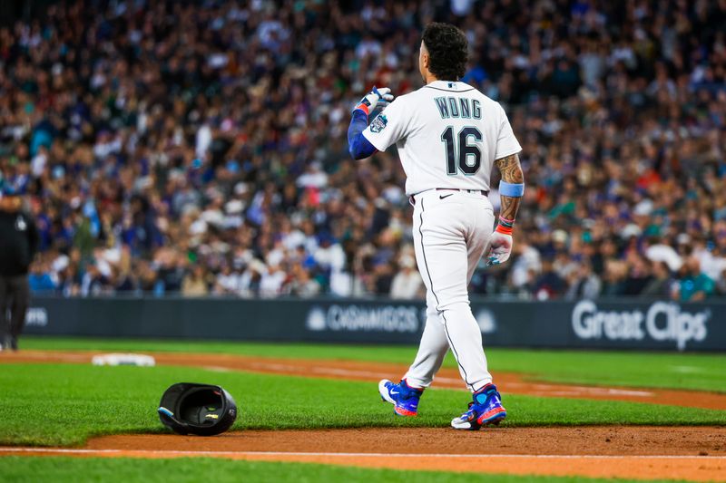 Jun 18, 2023; Seattle, Washington, USA; Seattle Mariners second baseman Kolten Wong (16) tosses his helmet after striking out against the Chicago White Sox to end the fifth inning at T-Mobile Park. Mandatory Credit: Joe Nicholson-USA TODAY Sports