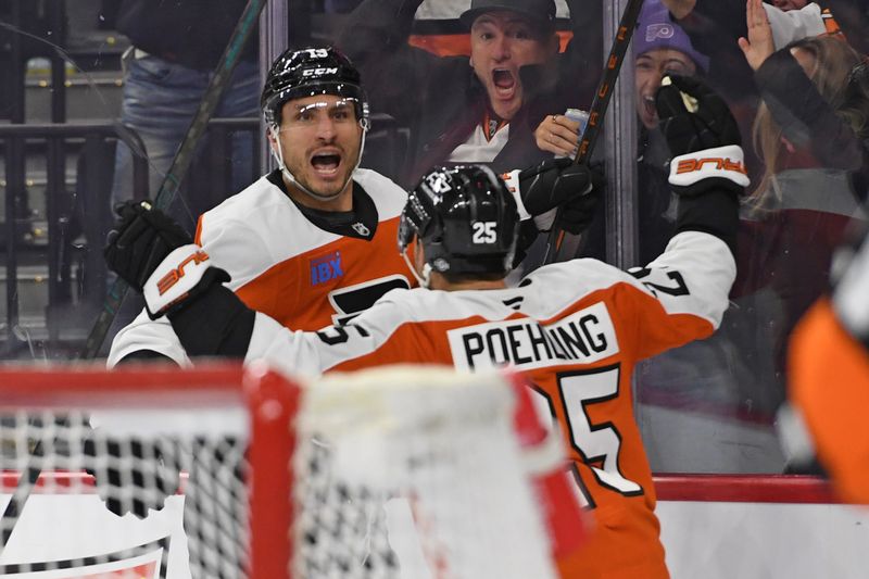 Dec 5, 2024; Philadelphia, Pennsylvania, USA; Philadelphia Flyers right wing Garnet Hathaway (19) celebrates his goal with center Ryan Poehling (25) against the Florida Panthers during the third period at Wells Fargo Center. Mandatory Credit: Eric Hartline-Imagn Images