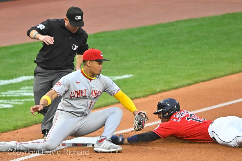 Sep 27, 2023; Cleveland, Ohio, USA; Cleveland Guardians right fielder Ramon Laureano (10) steals third base beside Cincinnati Reds third baseman Noelvi Marte (16) in the second inning at Progressive Field. Mandatory Credit: David Richard-USA TODAY Sports