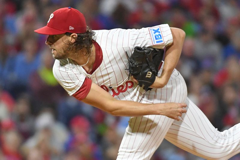 Sep 23, 2024; Philadelphia, Pennsylvania, USA; Philadelphia Phillies pitcher Aaron Nola (27) throws a pitch during the fourth inning against the Chicago Cubs at Citizens Bank Park. Mandatory Credit: Eric Hartline-Imagn Images