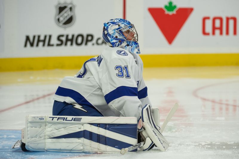 Nov 4, 2023; Ottawa, Ontario, CAN; Tampa Bay Lightning jonas Johansson (31) warms up prior to the start of the first period against the Ottawa Senators at the Canadian Tire Centre. Mandatory Credit: Marc DesRosiers-USA TODAY Sports