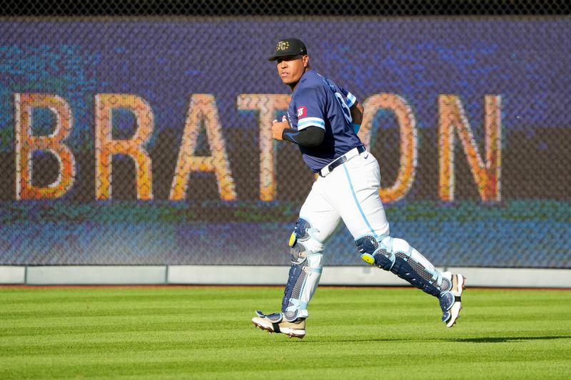 May 17, 2024; Kansas City, Missouri, USA; Kansas City Royals catcher Salvador Perez (13) warms up in the outfield prior to a game against the Oakland Athletics at Kauffman Stadium. Mandatory Credit: Denny Medley-USA TODAY Sports