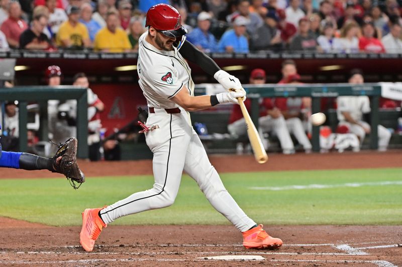 Apr 17, 2024; Phoenix, Arizona, USA;  Arizona Diamondbacks shortstop Blaze Alexander (9) singles in the second inning against the Chicago Cubs at Chase Field. Mandatory Credit: Matt Kartozian-USA TODAY Sports