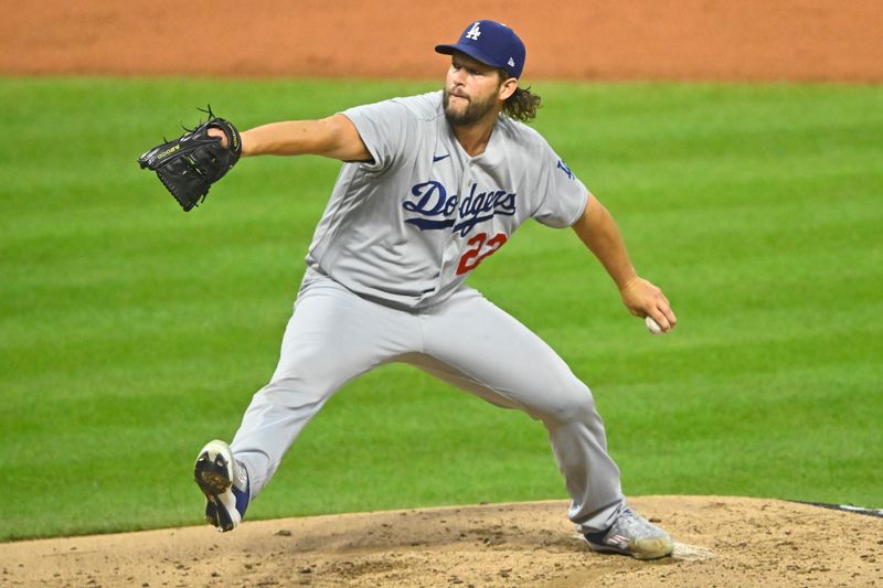 Aug 23, 2023; Cleveland, Ohio, USA; Los Angeles Dodgers starting pitcher Clayton Kershaw (22) delivers a pitch in the second inning against the Cleveland Guardians at Progressive Field. Mandatory Credit: David Richard-USA TODAY Sports