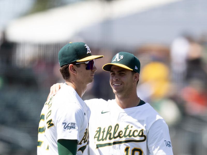 Jun 5, 2025; West Sacramento, California, USA; Athletics infielders Tyler Soderstrom (21) and Max Muncy (10) celebrate their 14-3 victory over the Minnesota Twins at Sutter Health Park. Mandatory Credit: D. Ross Cameron-Imagn Images