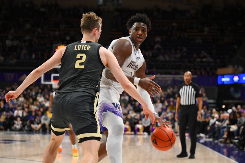 Jan 15, 2025; Seattle, Washington, USA; Washington Huskies forward Great Osobor (1) dribbles the ball while guarded by Purdue Boilermakers guard Fletcher Loyer (2) during the second half at Alaska Airlines Arena at Hec Edmundson Pavilion. Mandatory Credit: Steven Bisig-Imagn Images