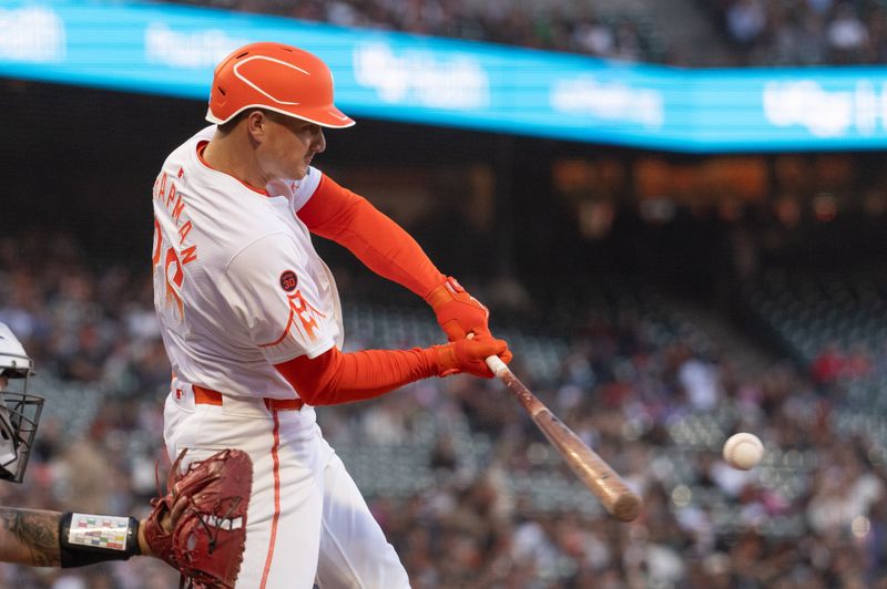 Aug 20, 2024; San Francisco, California, USA;  San Francisco Giants third base Matt Chapman (26) hits a single during the second inning against the Chicago White Sox at Oracle Park. Mandatory Credit: Stan Szeto-USA TODAY Sports
