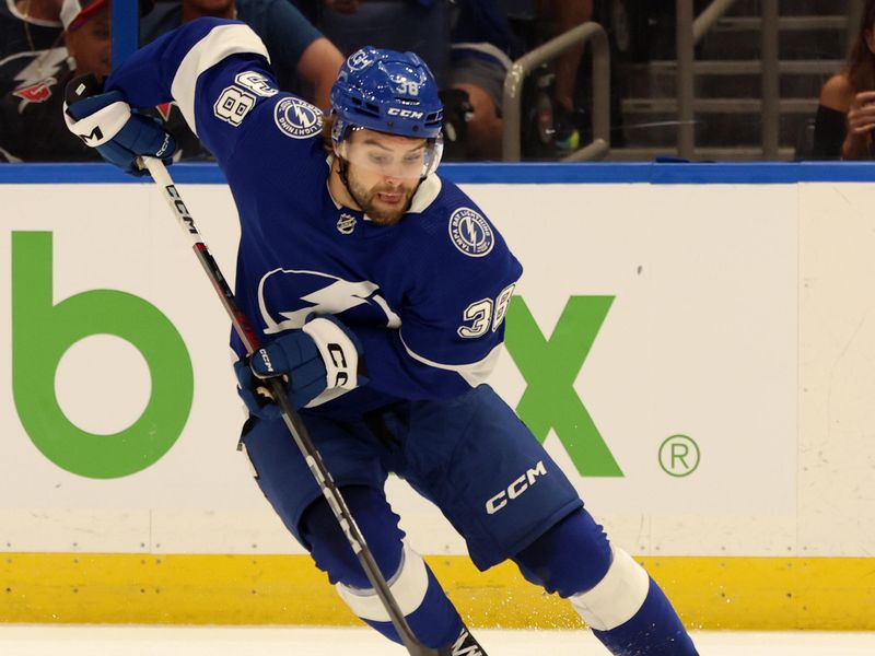 Apr 15, 2024; Tampa, Florida, USA;  Tampa Bay Lightning left wing Brandon Hagel (38) skates with the puck against the Buffalo Sabres during the first period at Amalie Arena. Mandatory Credit: Kim Klement Neitzel-USA TODAY Sports